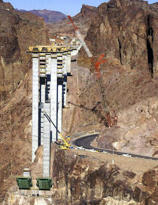 The top of the Hoover Dam is the route of the major road US 93 as it crosses the Colorado River. The route of the road had to be changed and an alternate crossing of the river developed.