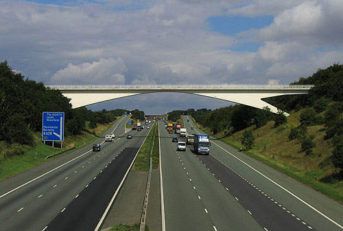 The dual three-lane motorway opened in 1959.