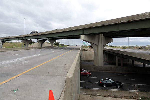 I-435 Eastbound looking at I-35 South flyover before construction. Credit: HNTB Corporation.