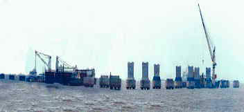 Giant floating cranes with accurate anchoring devices are used for shipping and erecting the girders.