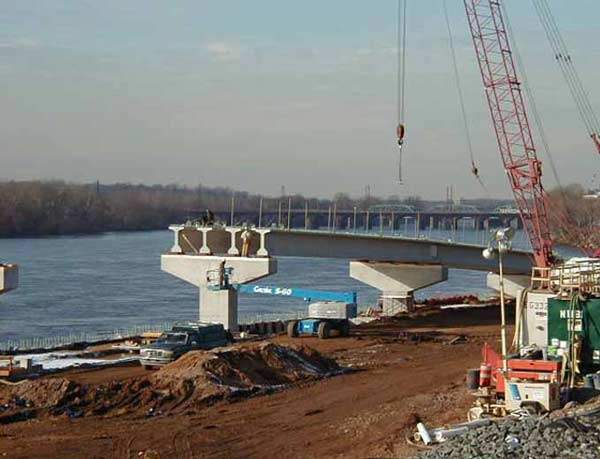 Looking northwest, placement of the AASHTO precast girders for the Ramp D bridge which will connect